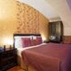 Bed closeup with nightstand and wardrobe at SKARITZ Hotel Bratislava